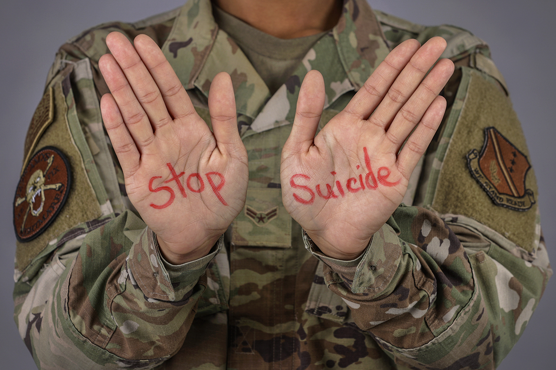 Soldier with Stop Suicide written on their hands Soldier with Stop Suicide written on their hands